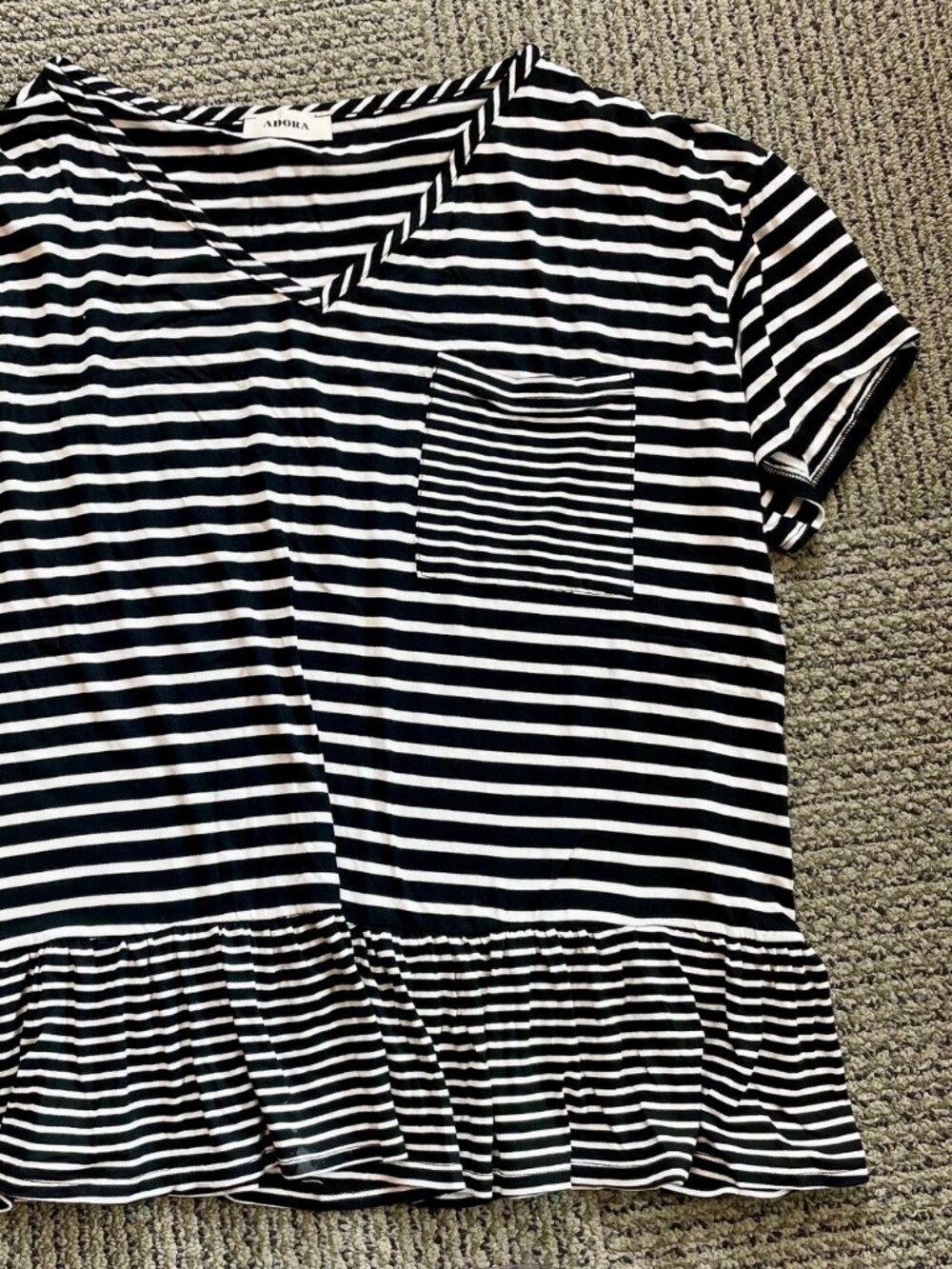Super-soft black & white striped pocket t-shirt with ruffle bottom